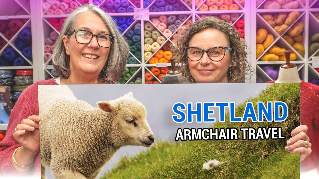 hosts showing poster with text 'Shetland Armchair Travel'