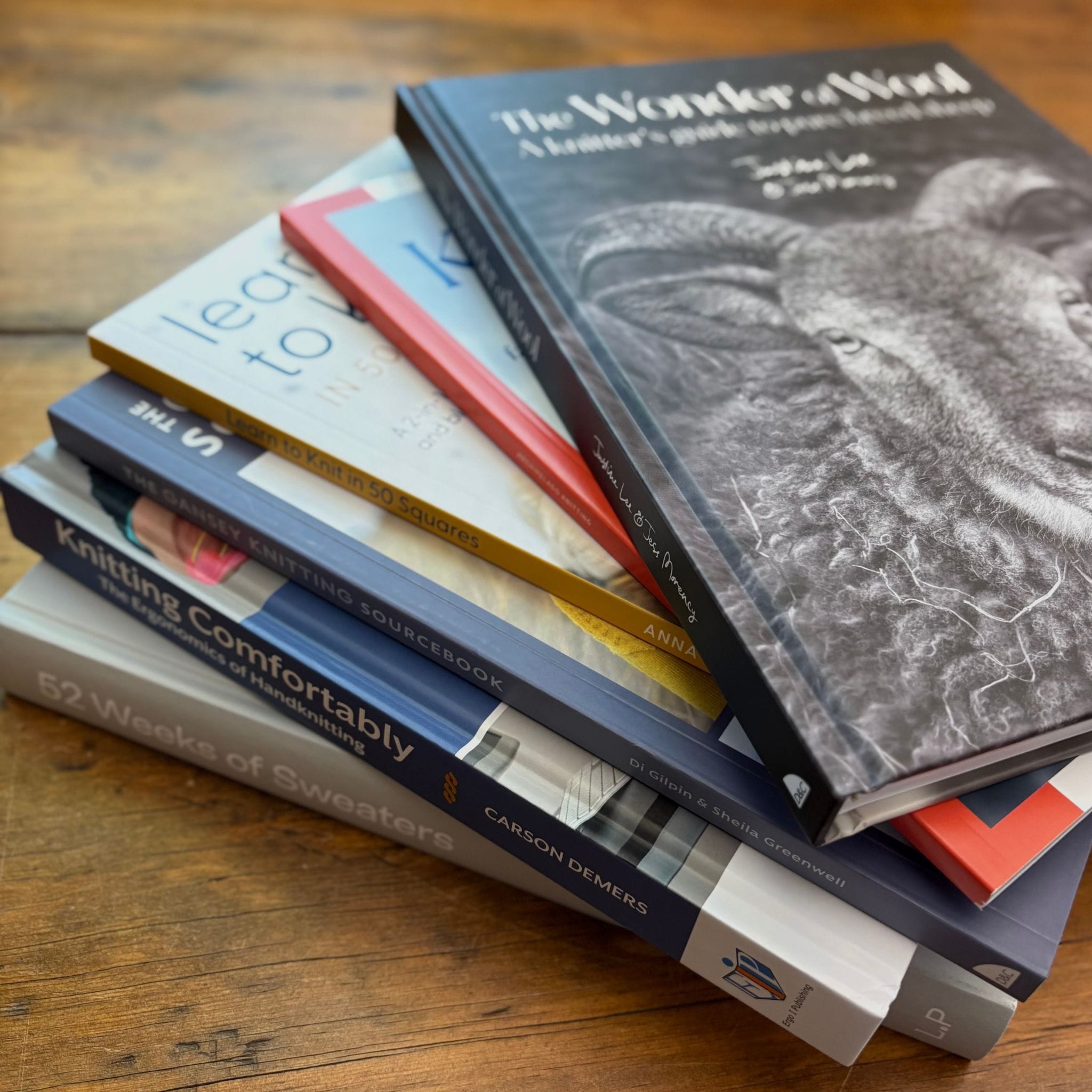 Knitting Books arranged in a stack.