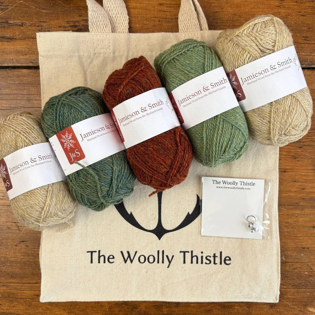 Shamrock Hat yarn set items in light colorway from The Woolly Thistle including Jamieson & Smith 2-ply Jumper Weight yarn, tote bag, and stitch marker.