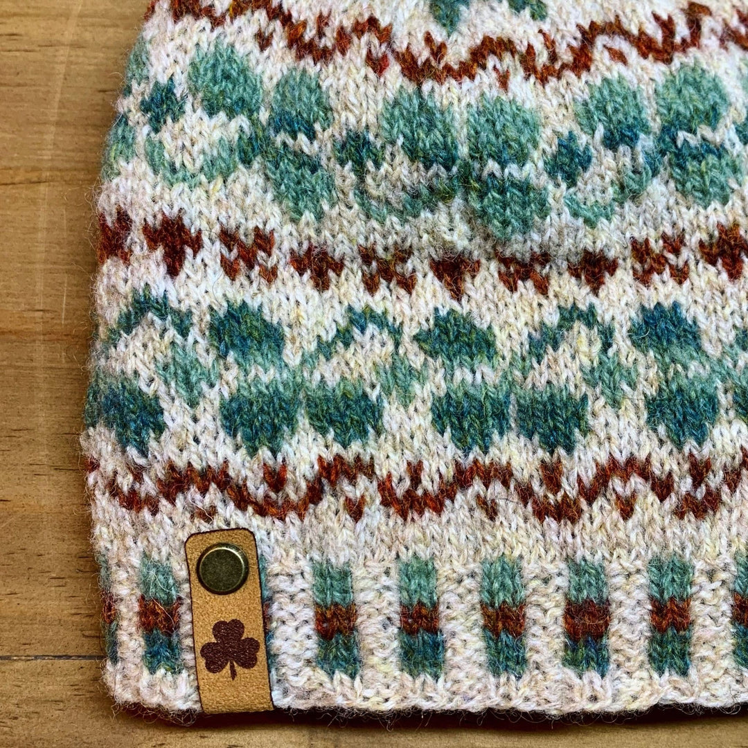 Detail of Shamrock Hat colorwork pattern in Jamieson & Smith 2-ply Jumper Weight featuring green shamrocks on a light background.