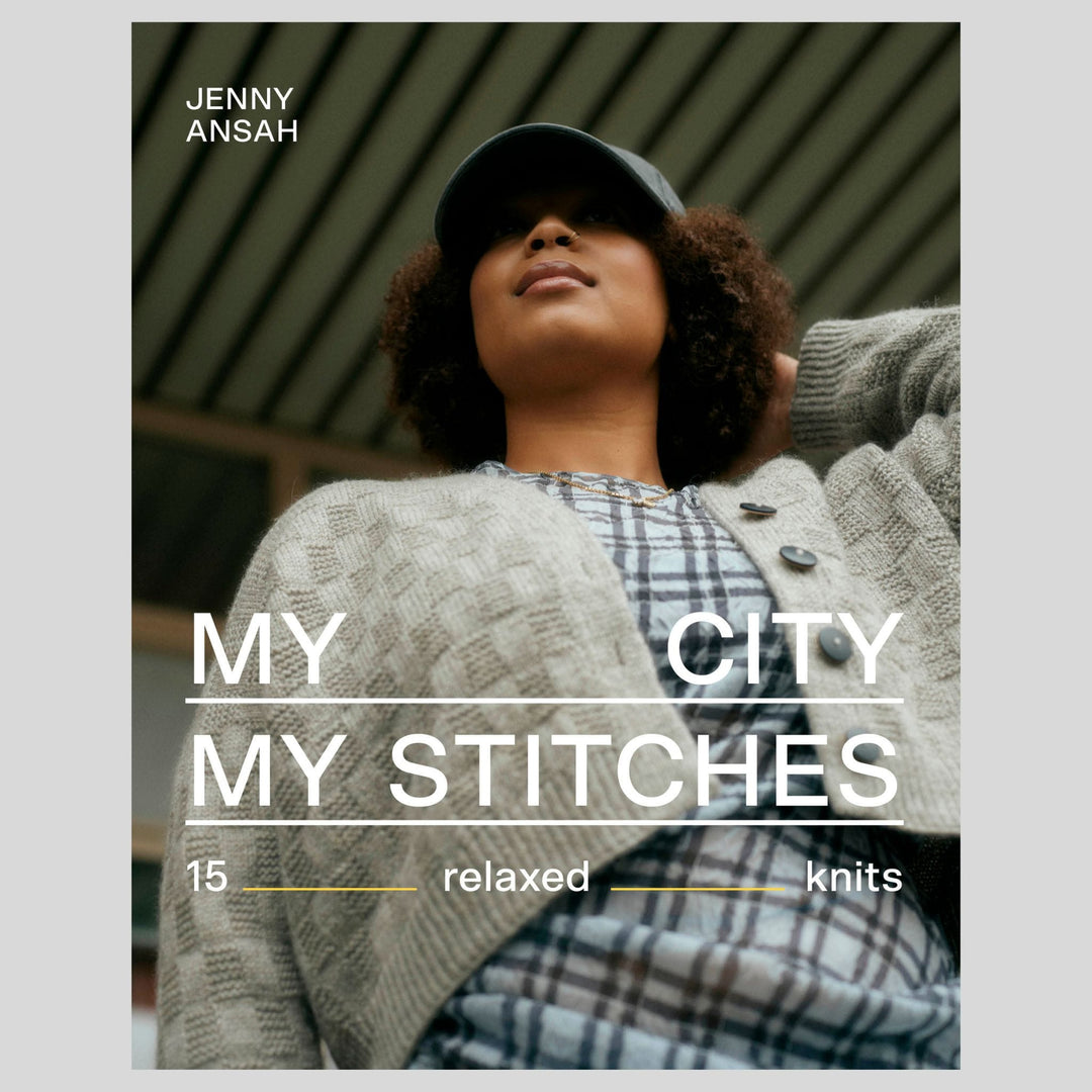 Published by Laine and sold at The Woolly Thistle, book cover with a person wearing a knit cardigan and cap, featuring text 'Jenny Ansa, My City My Stitches'.