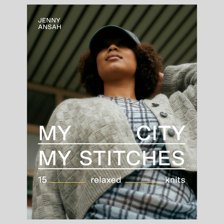 Published by Laine and sold at The Woolly Thistle, book cover with a person wearing a knit cardigan and cap, featuring text 'Jenny Ansa, My City My Stitches'.