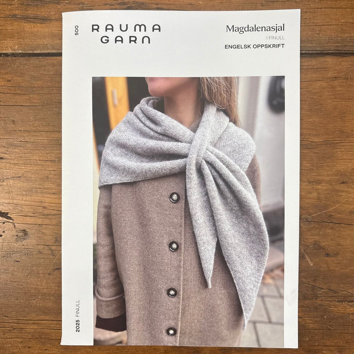 Rauma Garn pattern card cover for Magdalenasjal Shawl featuring a person wearing a gray scarf. 