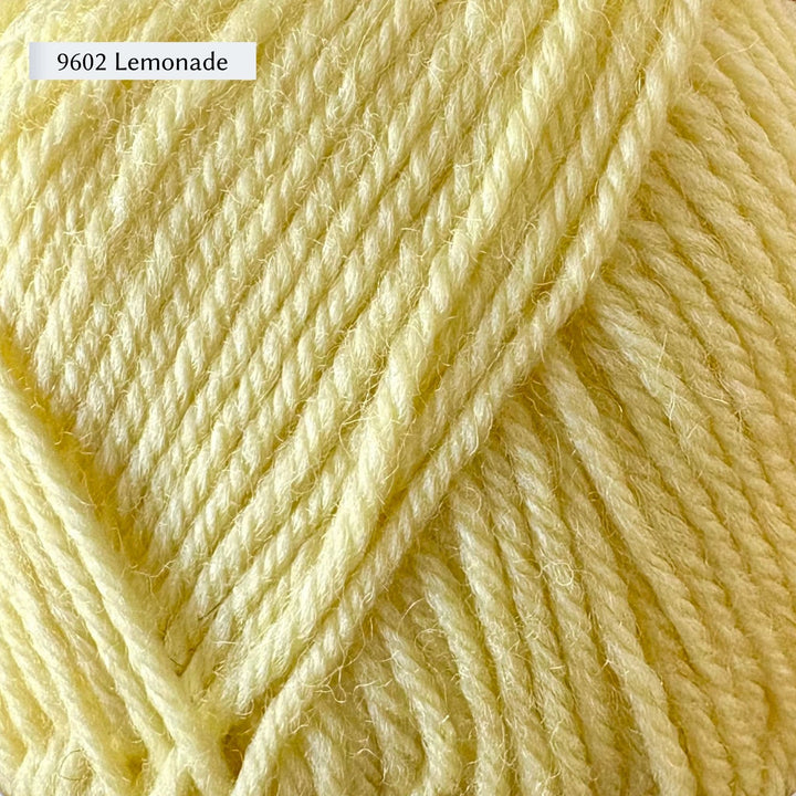 Close-up of lemon-colored yarn with a label '9602 Lemonade'.