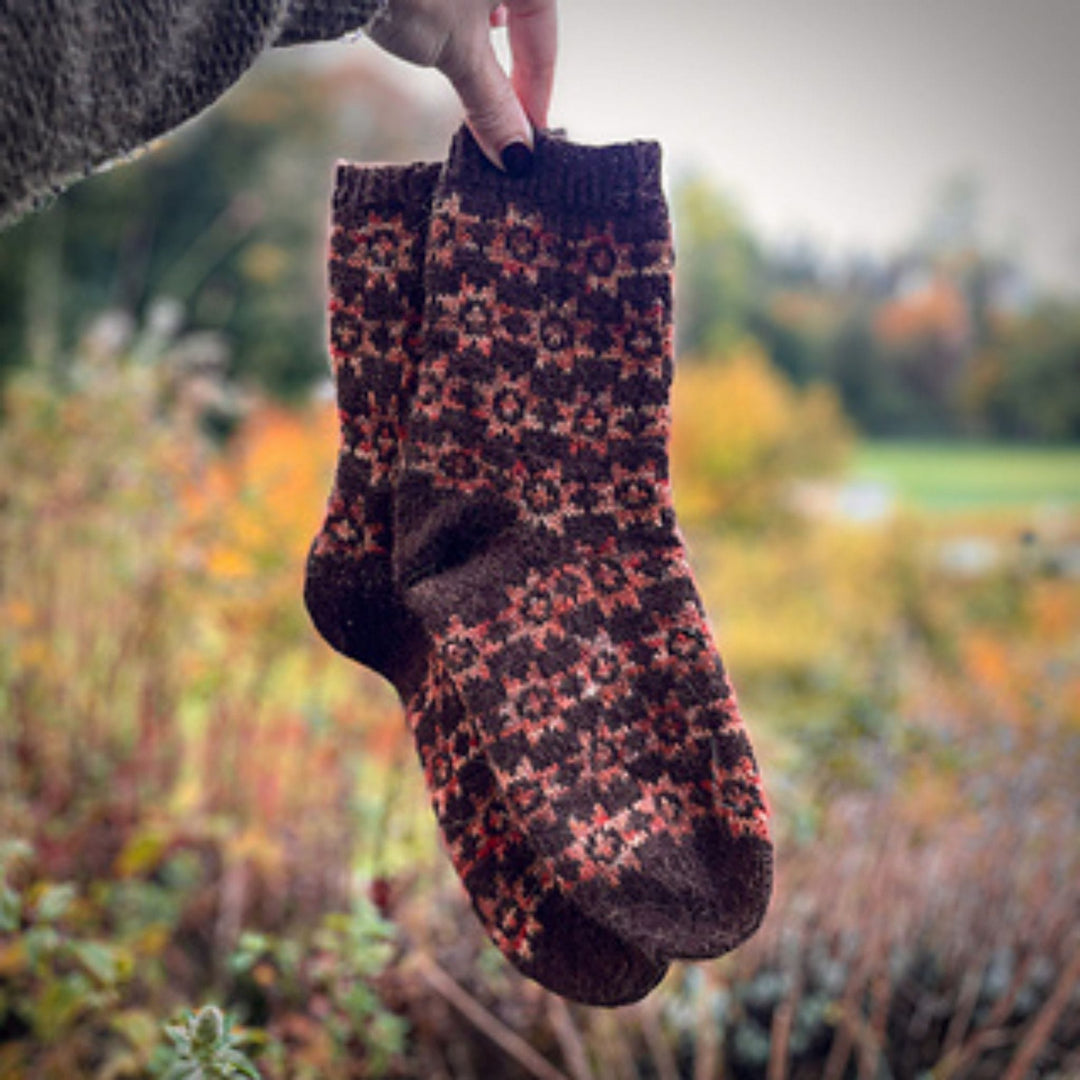 Under the Quilt Socks by Stone Knits in Sisu and Zauberball