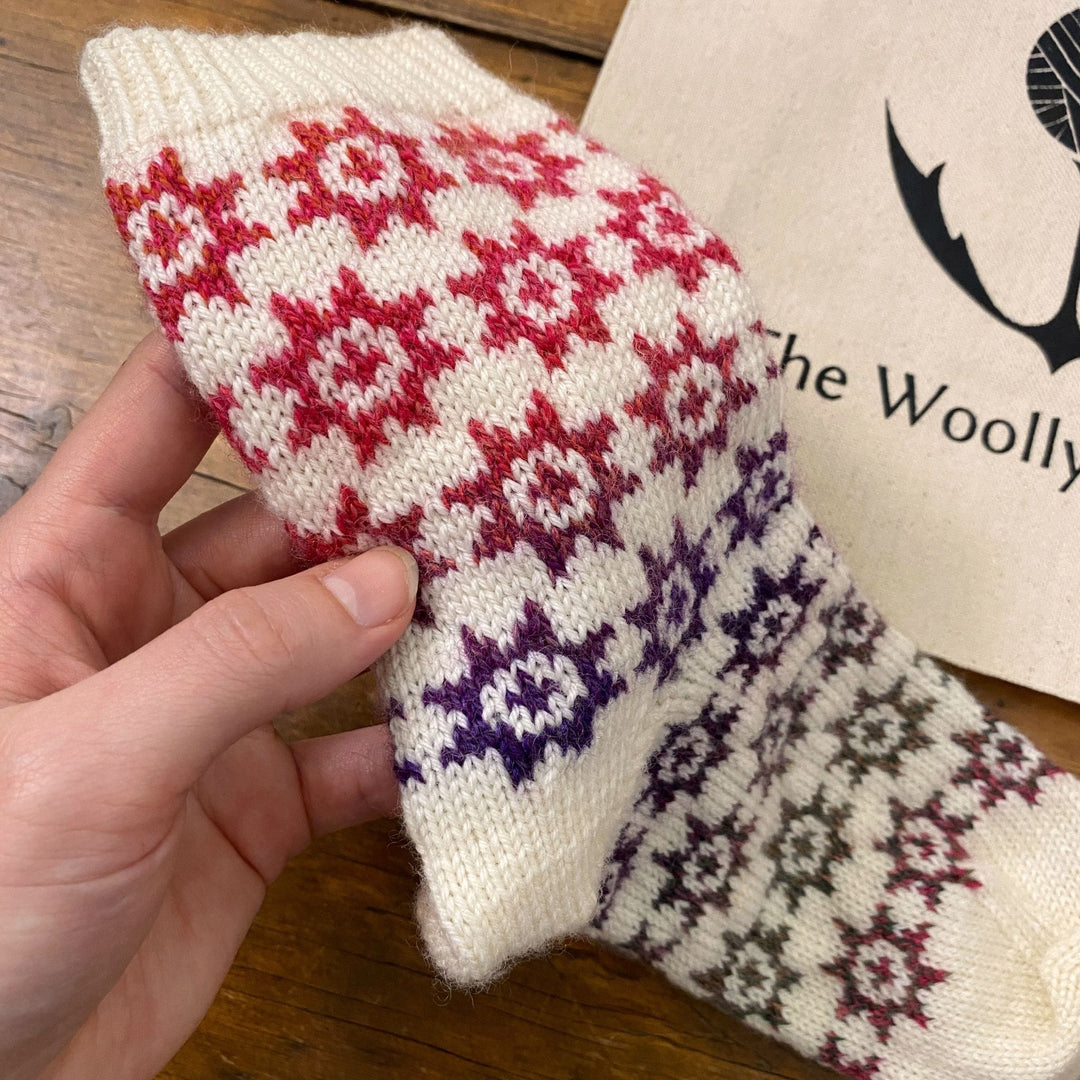 Under the Quilt Socks by Stone Knits in Sisu and Zauberball