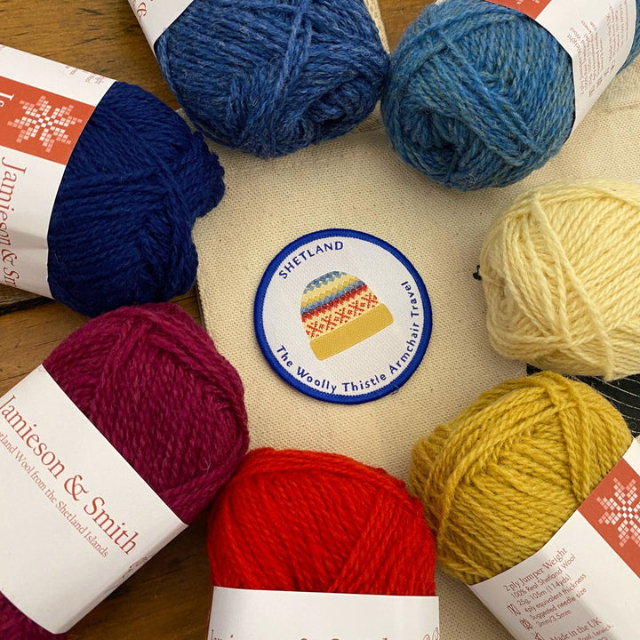 'Shetland The Woolly Thistle Armchair Travel' patch shown with Shetland Yarn from Jamieson & Smith