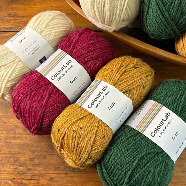 Baubles & Bows Blanket by Anna Nikipirowicz in ColourLab Aran