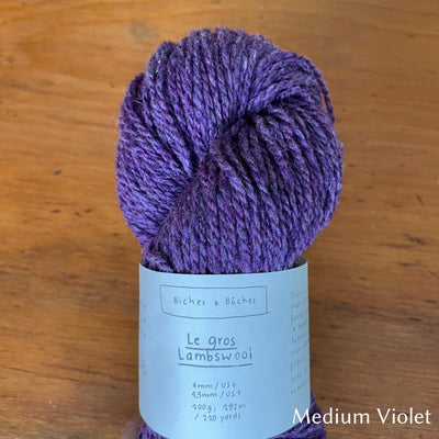 Skein of  Biches & Buches Les Gros Yarn in medium violet/purple.