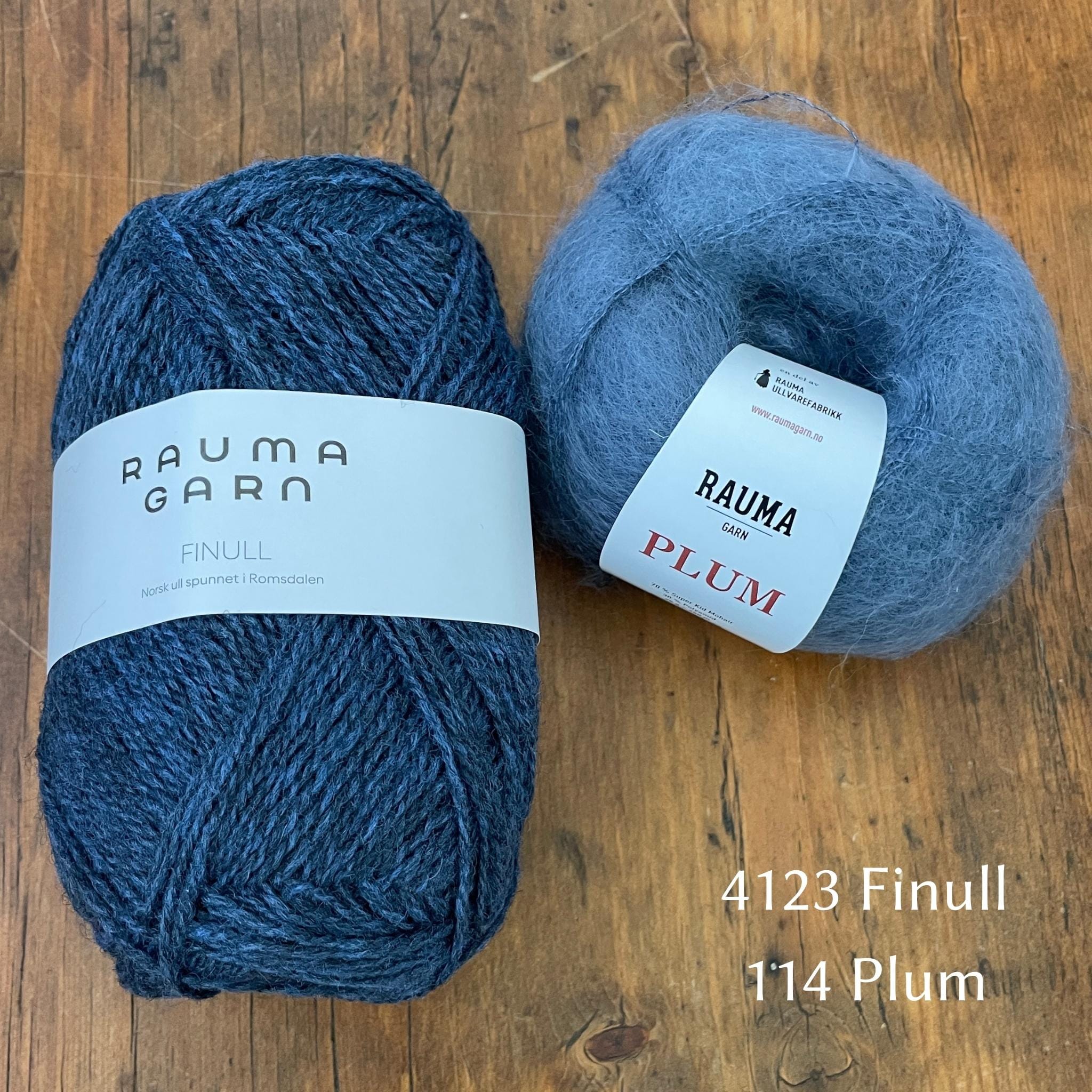 Ball of Rauma Finullgarn yarn in heathered blue with coordinating Plum yarn 