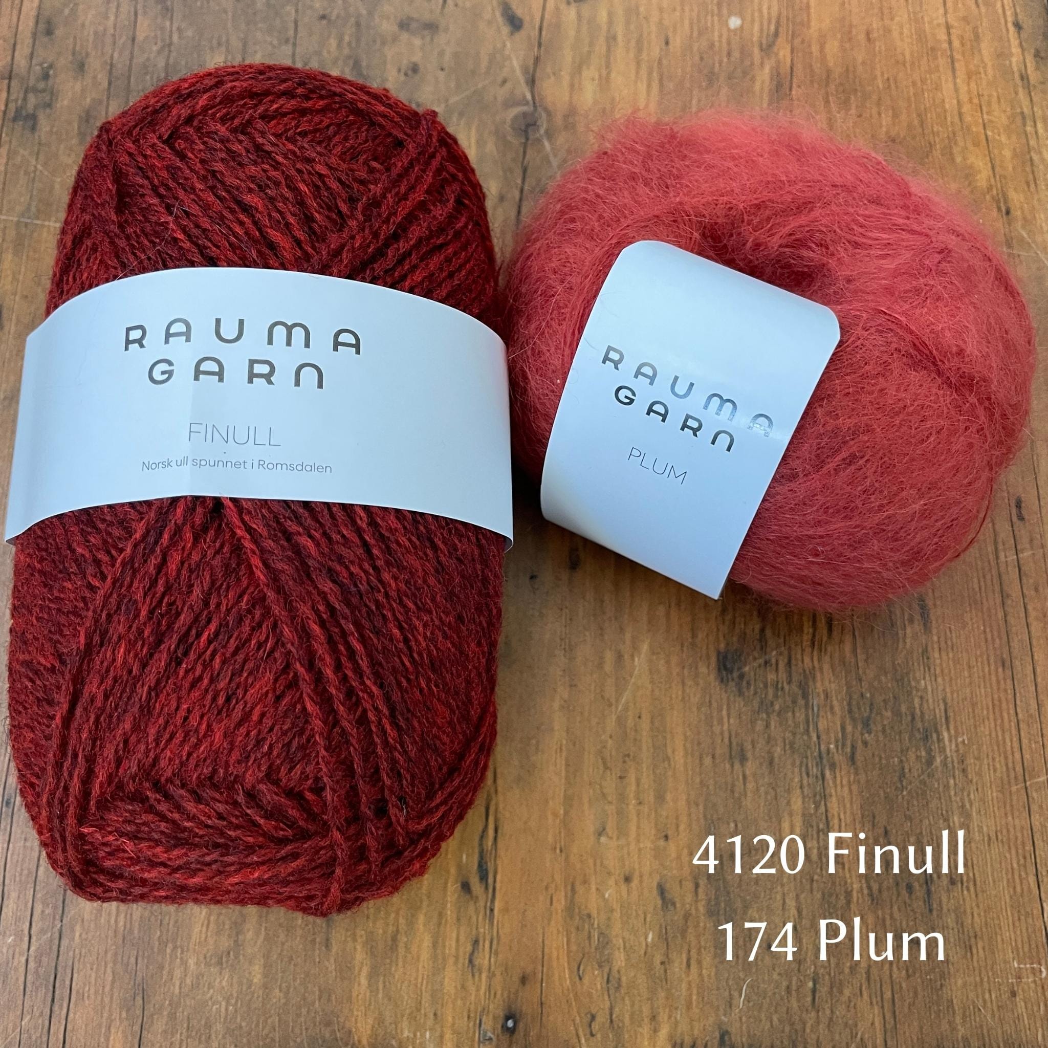 Rauma Finullgarn yarn in heathered red with coordinating Plum yarn 
