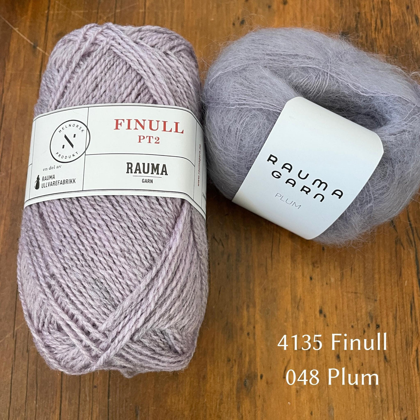 Ball of Rauma Finullgarn yarn in heathered lgiht purple with coordinating Plum yarn 