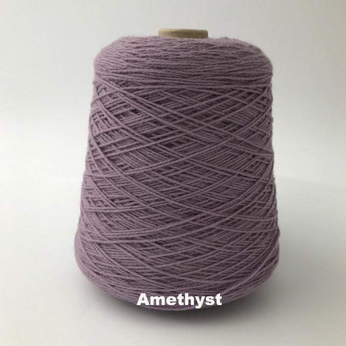 Cone of Frangipani 5-ply Guernsey Wool Yarn in colorway Amethyst, a shade of purple.