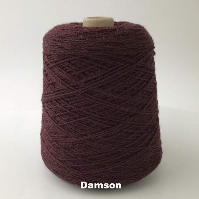 Cone of Frangipani 5-ply Guernsey Wool Yarn in colorway Damson, a deep wine color.