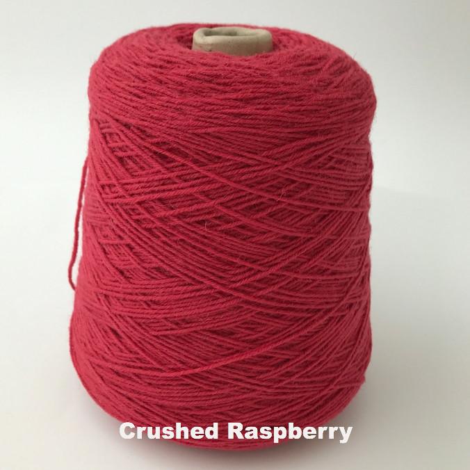 Cone of Frangipani 5-ply Guernsey Wool Yarn in colorway Crushed Raspberry.