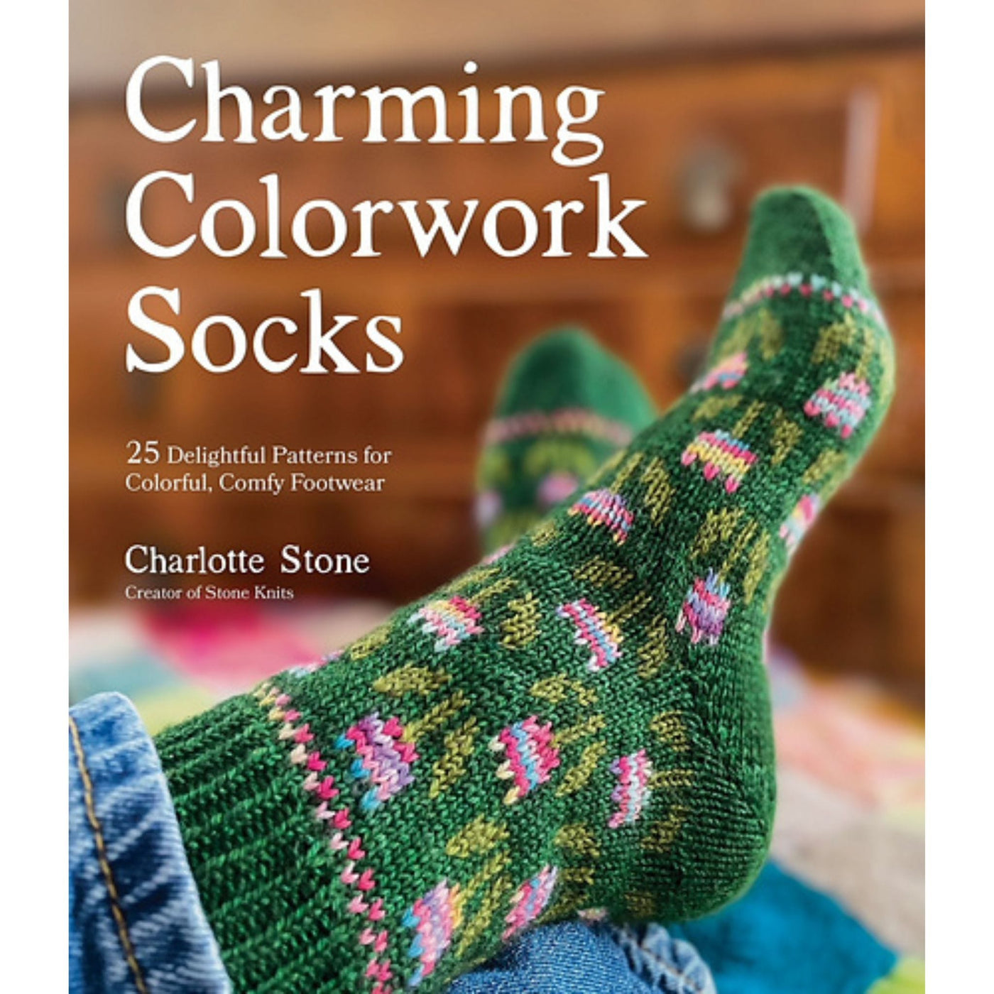 Cover image for Charming Colorwork Socks by Charlotte Stone, with feet wearing green socks with a multicolor tulip pattern
