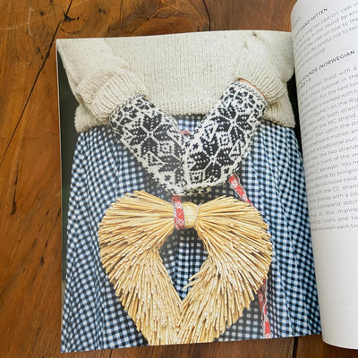 Page of Nordic Knitting Primer book with black and cream handknit mittens