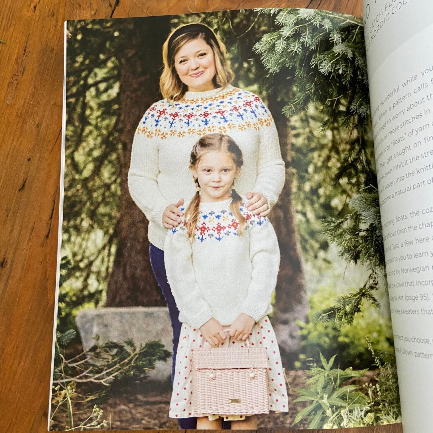 Page of Nordic Knitting Primer book with woman and girl wearing matching cream sweaters with colorwork yoke. 