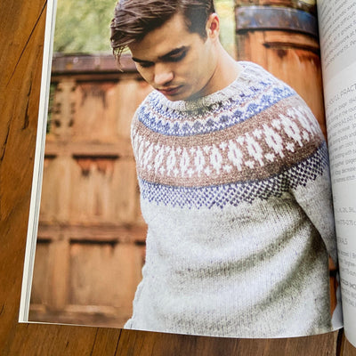 Page of Nordic Knitting Primer book with man wearing sweater with colorwork yoke.
