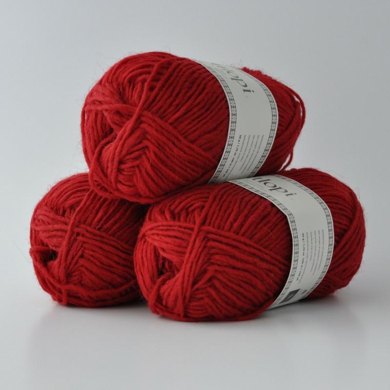 Ball of Lettlopi in colorway 9434 - crimson red.
