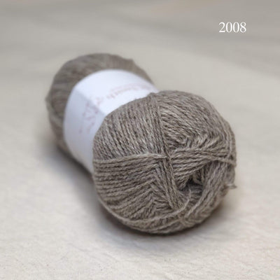 A ball of Jamieson & Smith Shetland Supreme, a fingering weight wool yarn, in color 2008, Katmollet, a light warm grey