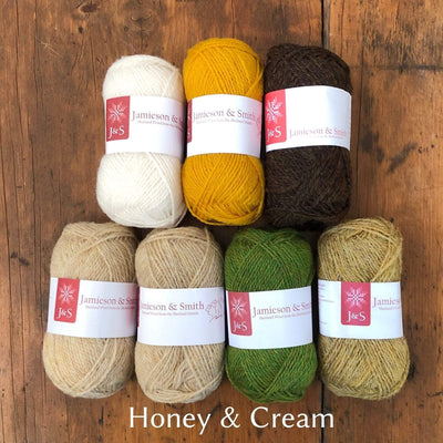 Jamieson and Smith Yarn in shades of beige, yellows cream, brown and green.