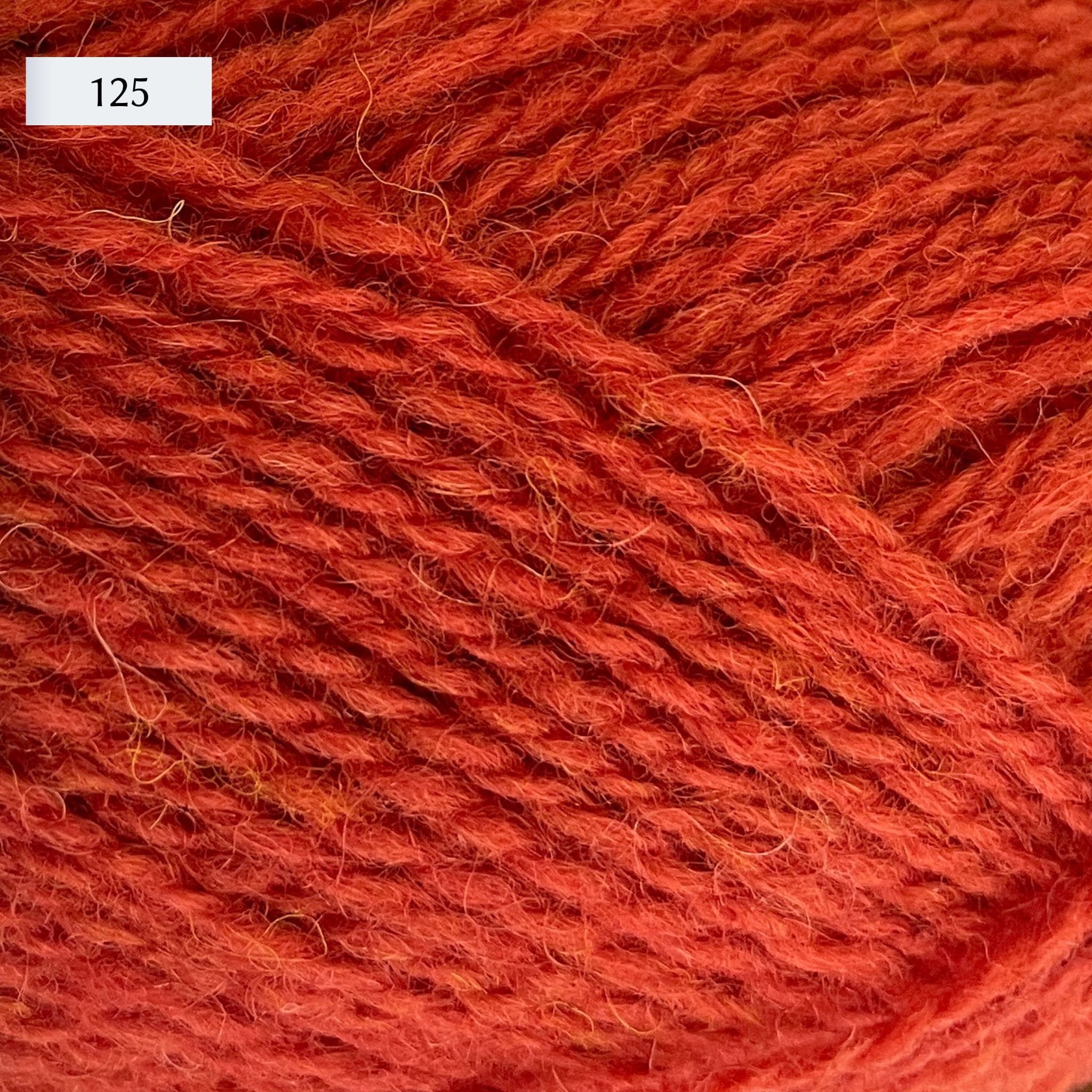 Jamieson & Smith 2ply Jumper Weight, light fingering weight yarn, in color 125, an orange-red