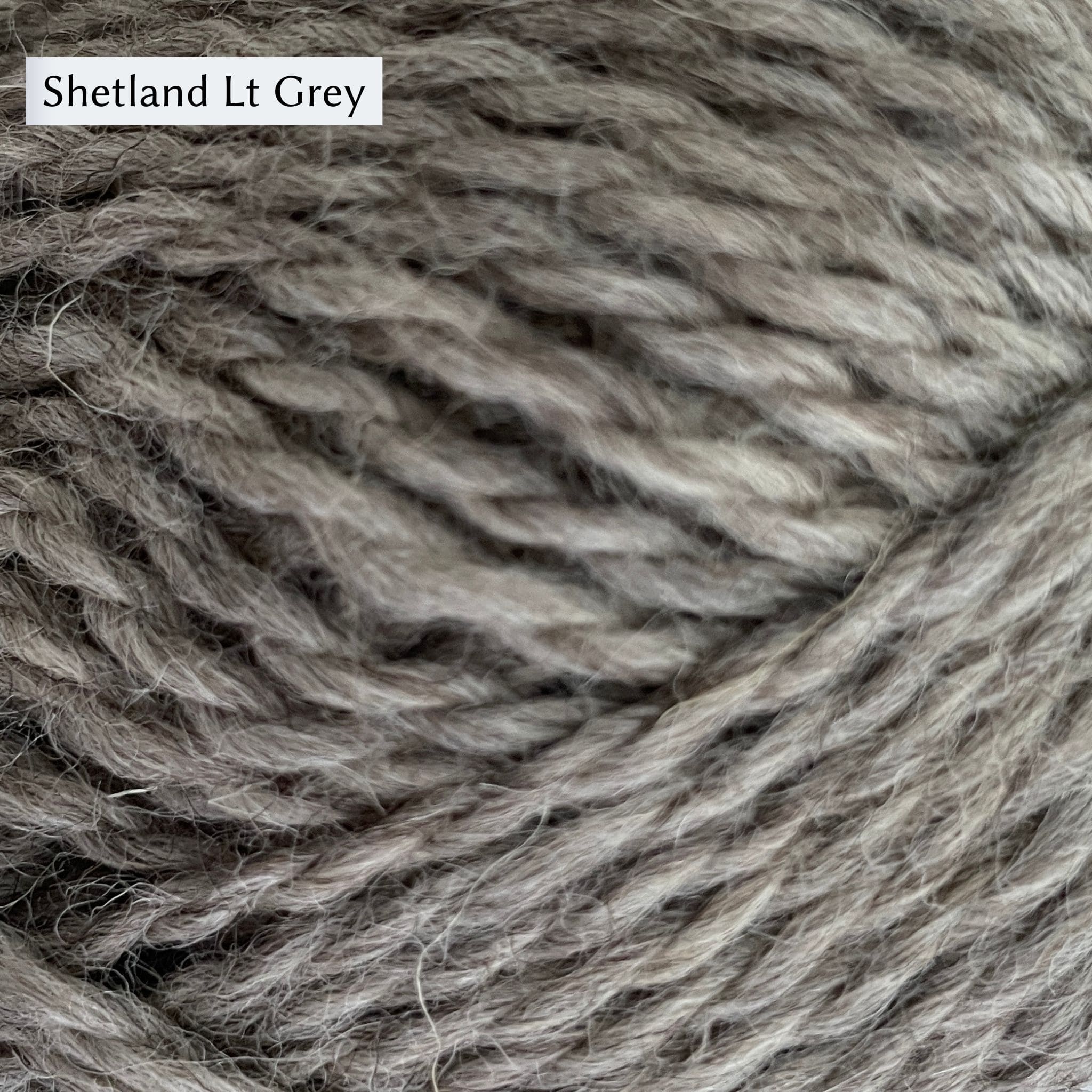 Jamieson & Smith Aran Worsted Yarn close up photo of Shetland Lt Grey Colorway which is a true grey color.