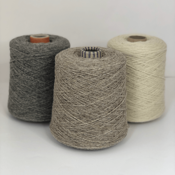 Three cones of Jamieson & Smith Shetland Supreme, a fingering weight wool yarn,