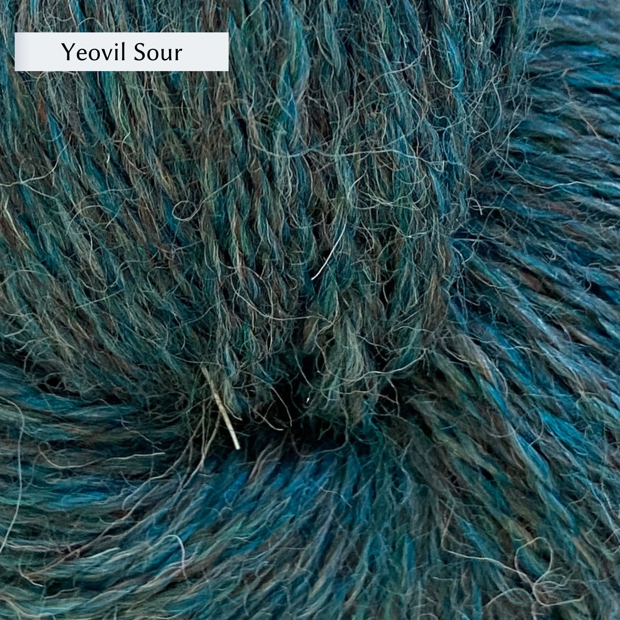John Arbon Appledore DK, a DK weight British yarn, in color Yeovil Sour, a petrol teal with grey and cream heathering