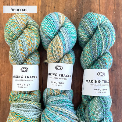 Junction Fiber Mill Making Tracks yarn, a DK weight, barberpole yarn, in color Seacoast, a variegated light green, blue, teal, and yellow
