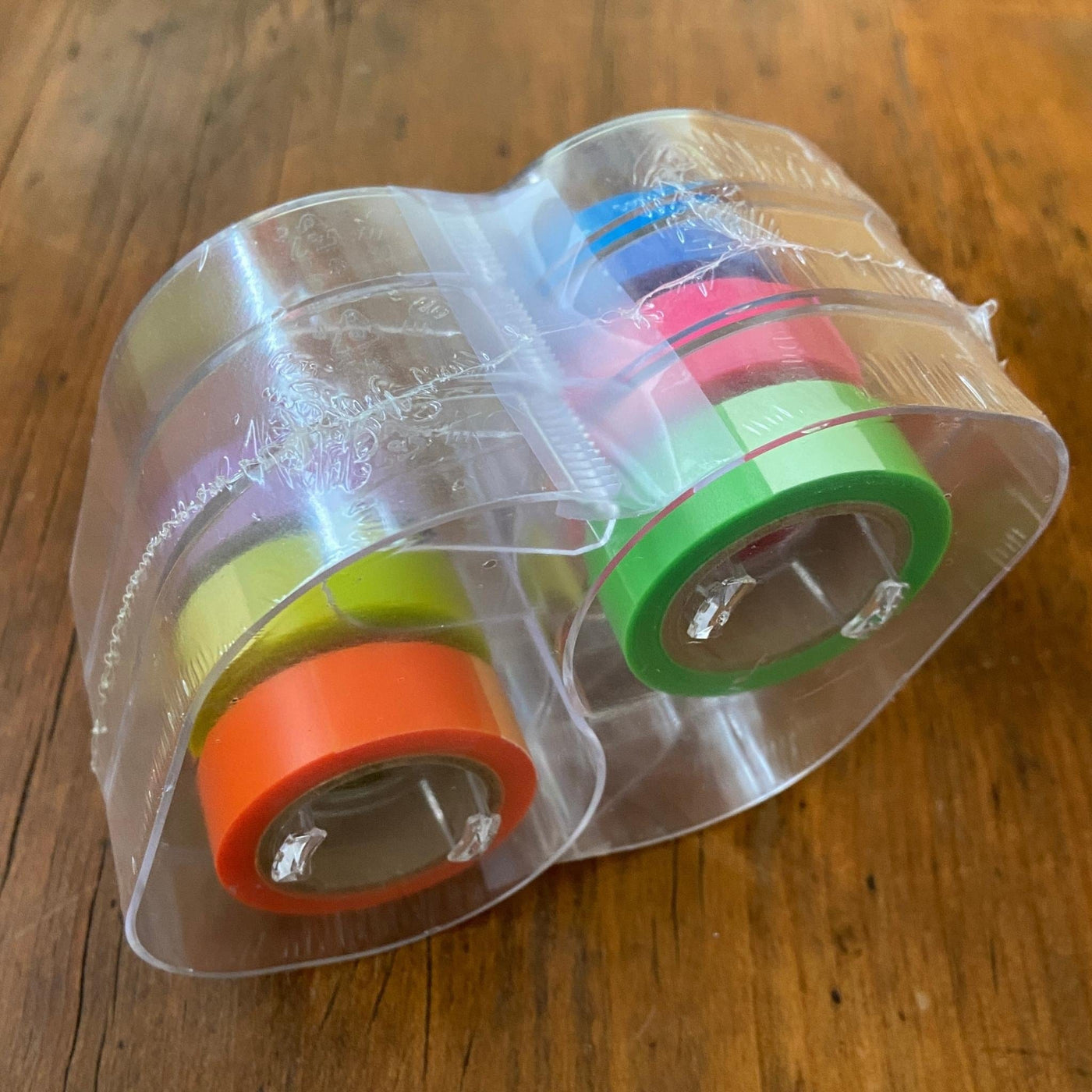 Package of highlighter tape in orange, green, yellow, pink, blue, and purple