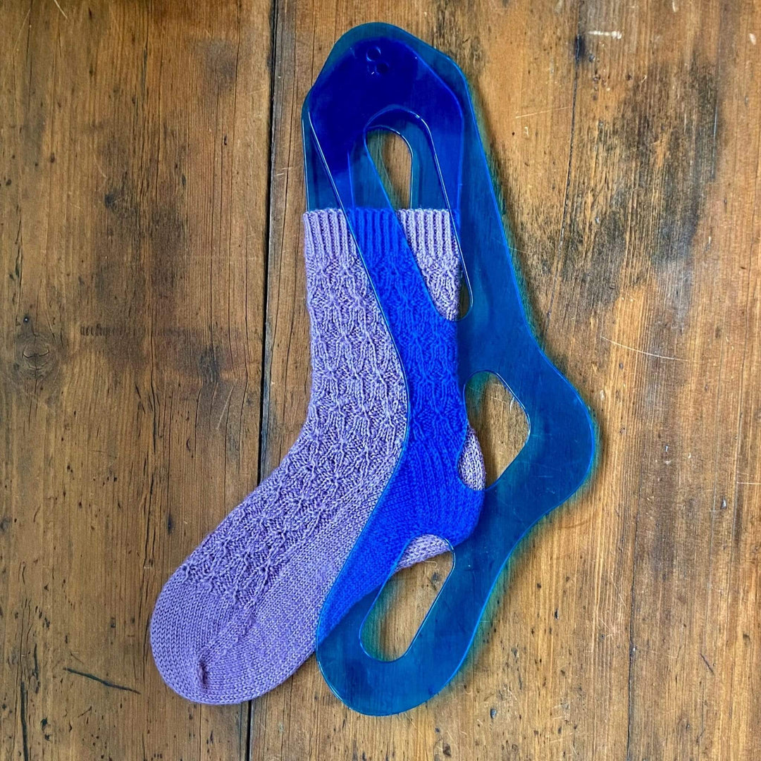 Acrylic sock blockers for knit socks in a women's size medium. Shown with a hand knit Agatha Sock knit in West Yorkshire Spinners yarn.
