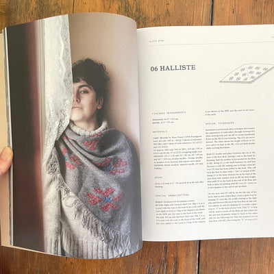 Pattern pages for Halliste, a pattern in 52 Weeks of Scarves, showing a photo of the finished grey and red scarf on the page opposite the pattern information