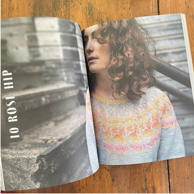 Strands of Joy book page spread, Title page on left "10 Rose Hip", photo of woman in gray sweater with pink, orange, yellow motif