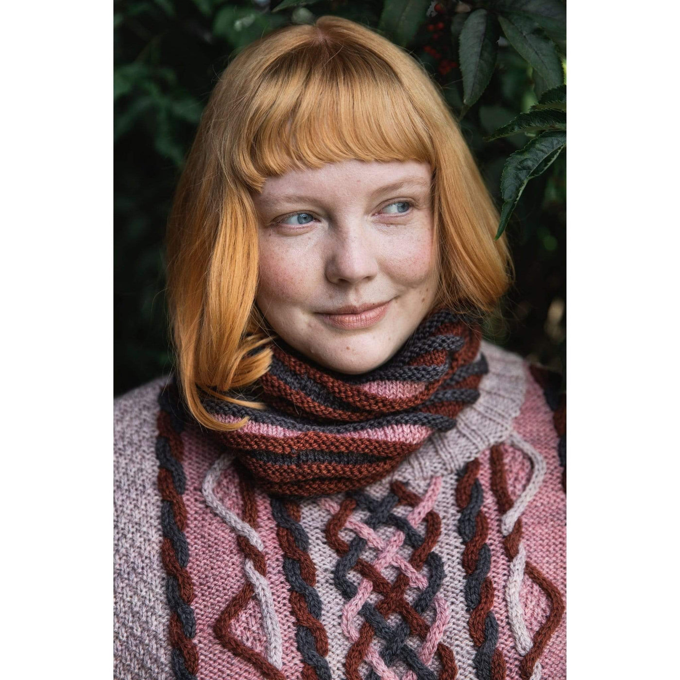 The Woolly Thistle Worsted – A Knitwear Collection Curated by Aimée Gille of La Bien Aimée published by Laine woman wearing knitted pink sweater 