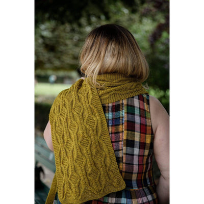 The Woolly Thistle Worsted – A Knitwear Collection Curated by Aimée Gille of La Bien Aimée published by Laine woman wearing mustard yellow knitted scarf