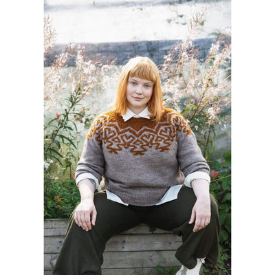 The Woolly Thistle Worsted – A Knitwear Collection Curated by Aimée Gille of La Bien Aimée published by Laine woman wearing grey and brown knitted sweater