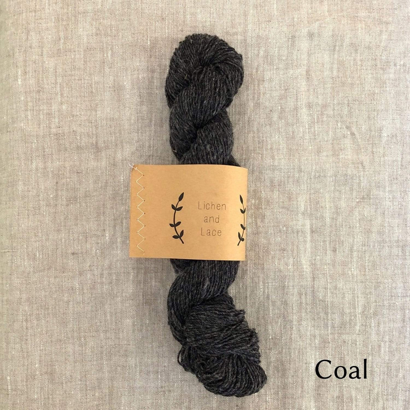 Lichen & Lace Rustic Heather Sport, a sport weight single-ply yarn, in color Coal, a dark heathered grey