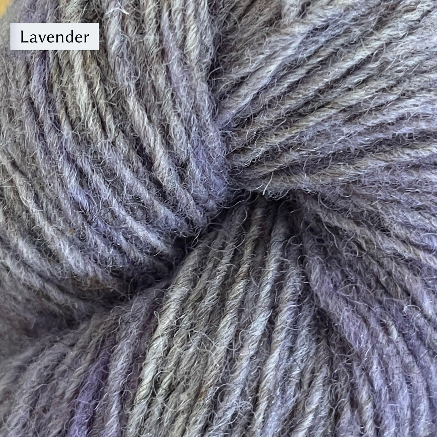 Lichen & Lace Rustic Heather Sport, a sport weight single-ply yarn, in Lavender, a heathered light purple