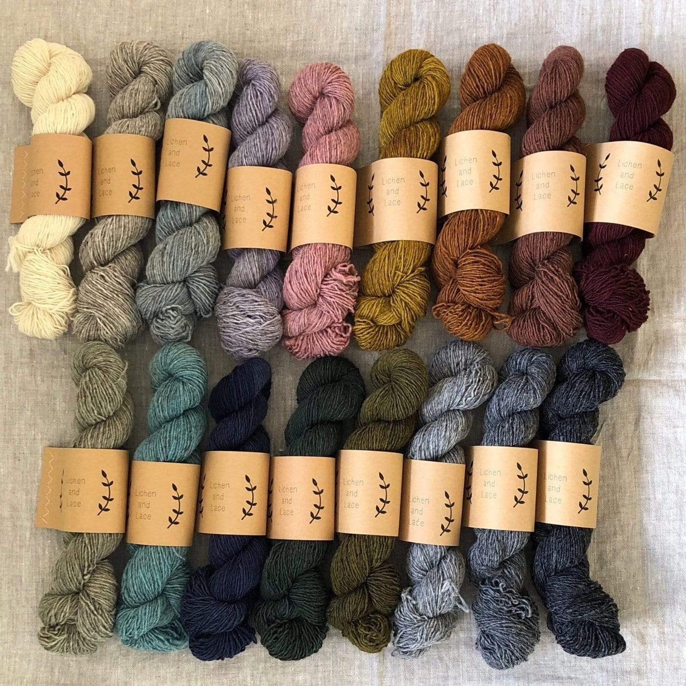 The range of colors in Lichen & Lace Rustic Heather Sport, a sport weight single-ply yarn,