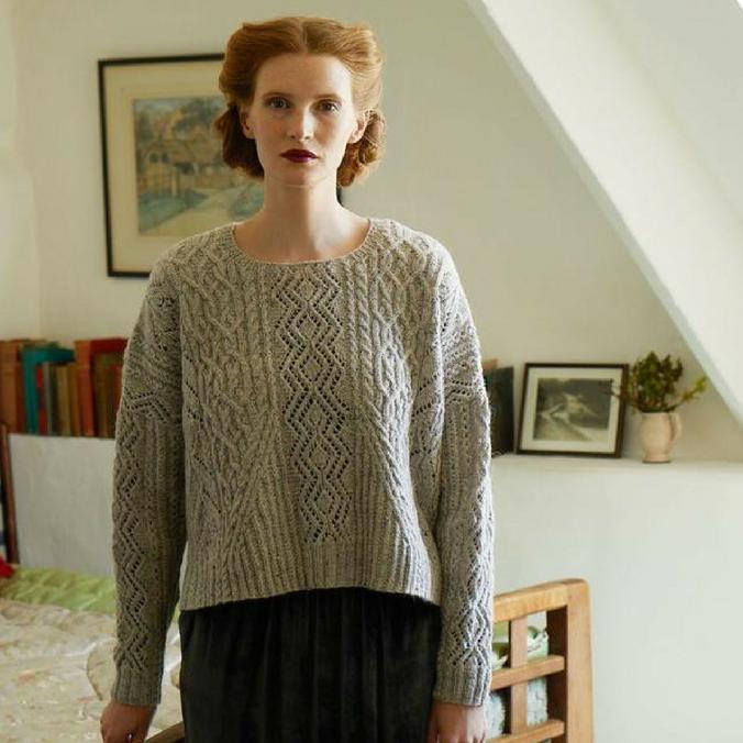 Model wearing Gray knit sweater designed by Marie Wallin.