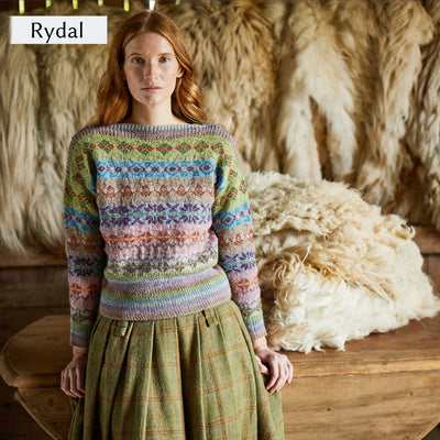 Model wearing Rydal, an all over colorwork sweater, from Cumbria Book by Mare Wallin color