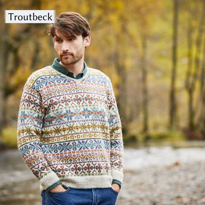 Male Model wearing Troutbeck, an all over colorwork sweater, from Cumbria Book by Mare Wallin color