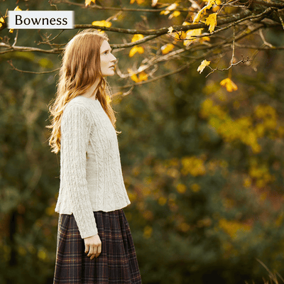 Model wearing Bowness, a textured sweater with peplum waist design from Cumbria Book by Mare Wallin color