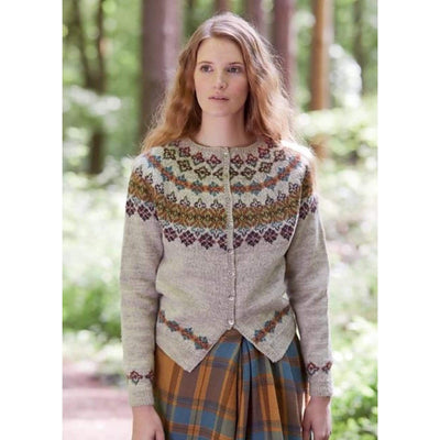 Hawthorn Sweater pattern by A woman wears the colorwork yoke cardigan pattern by Marie Wallin knit in British Breeds yarn. 