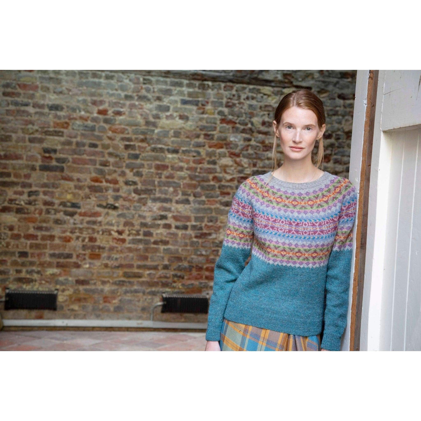 The Woolly Thistle Dana Yarn Set in Marie Wallin's British Breeds from CHERISH featuring woman wearing Dana sweater