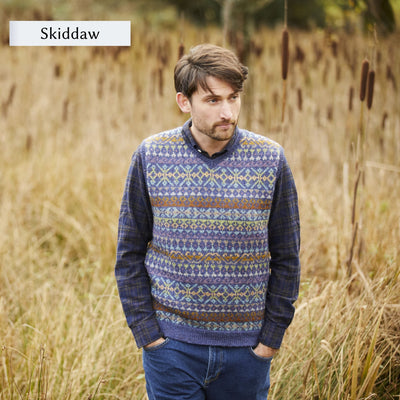 Male model wearing allover colorwork vest design, Skiddaw, from Westmorland book by Marie Wallin.