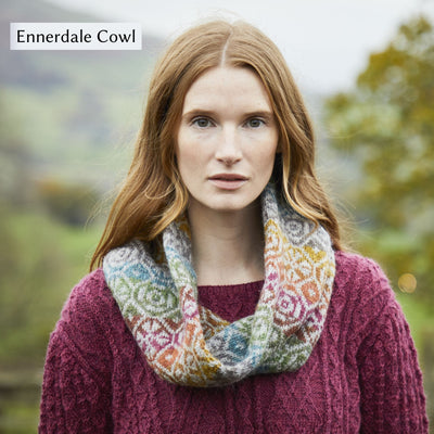 Female model wearing allover colorwork cowl design, Ennerdale Cowl, from Westmorland book by Marie Wallin.