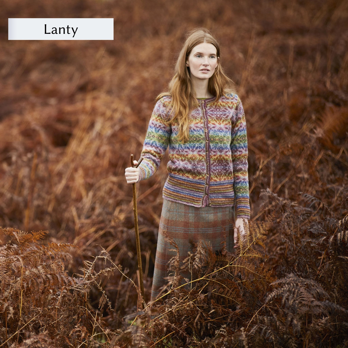 Female model wearing allover colorwork cardigan design, Lanty, from Westmorland book by Marie Wallin.